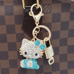 Authentic Louis Vuitton Lock & Key with unbranded Hello Kitty Bagcharm, Keycharm